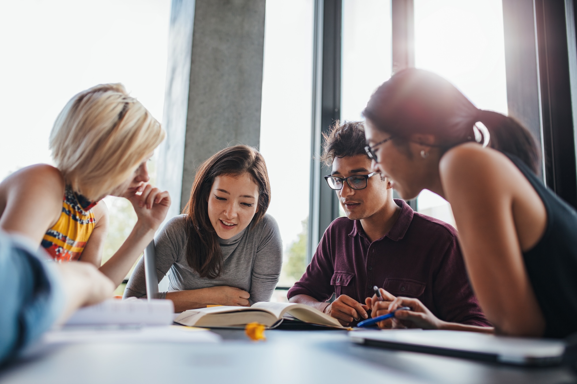 Performance Assessment Program | CBL Partners Media. Image shows four teenage students sitting at a round table